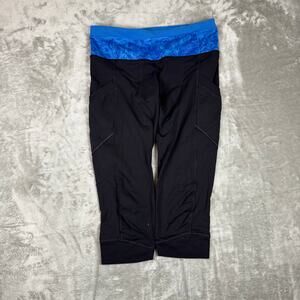 Lululemon Black w/ Blue Ruffle Waistband Pocket Capri Legging Sz 27 waist